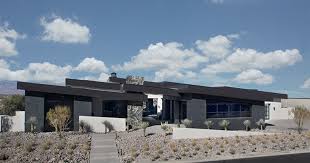 The various ceiling heights throughout presented an exciting puzzle for e2 homes to solve. The New American Home Sun West Custom Homes Llc