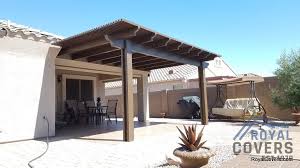 The cover was attached to the stucco wall, with 2 posts in the area covered by pavers. 11x17 Alumawood San Tan Valley 85143 Royal Covers