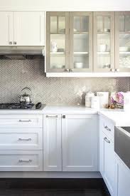 White Kitchen Cabinets With Gray Framed Glass Doors Shaker Style Kitchen Cabinets Kitchen Cabinet Styles Kitchen Backsplash Designs