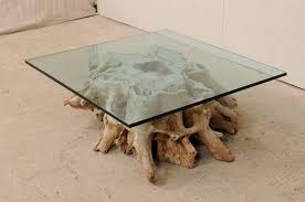 The wood is heated to reduce the moisture content and to preserve the wood. Custom Glass Top Coffee Table On 19th C European Natural Wood Tree Stump Base For Sale At 1stdibs