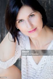 Brunette Woman With Green Eyes Stock Photo