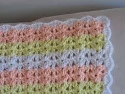 You could use this easy free pattern to crochet a charming baby blanket that has colorful, textural appeal. Shells And Double Crochets Baby Afghan Baby Afghan Crochet Patterns Double Crochet Baby Blanket Baby Afghan Crochet