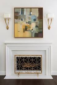 An optional 6th step is to add crown molding to the top of the woodwork (to the 1×4 on the very top). Art Above Fireplace Design Ideas