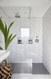 Get inspiration for bathroom floor tile ideas, shower tile designs and master bathroom layouts from the pictures below. White Chevron Tiling In Shower Glass Panels With Black Frame Bathroomtile Ensuite Shower Room Bathroom Interior Design Small Bathroom Remodel