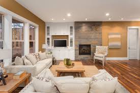If a tiny house has enough room for a fireplace, there's no place small enough to have them. Beautiful Living Room Interior With Hardwood Floors And Fireplace In New Luxury Home Two Couches At Right Angles And Pillows Frame Cozy Family Room With Coffee Table And Built In Cabinets Vivax