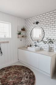 The watery blue and green mosaic tile border enlivens this classic subway tile look. A New Bathroom Accent Wall How To Hang A Mirror On Tile Love Create Celebrate
