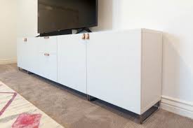 Once the rails are up, you simply hang the besta cabinets and secure them with the screws and covers included in the package. Extra Wide Media Cabinet Besta Ikea Details All Things Thrifty