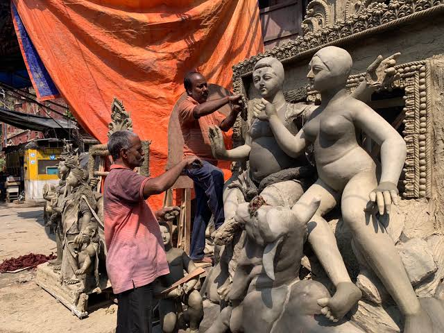 Artisans sculpting clay idols in Kumartuli, AI generated