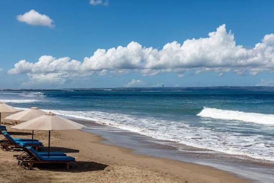 Batu Belig Beach in Bali — a spacious, relaxed stretch of sand at sunset