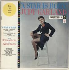 Listen the music / songs from the movie about the movie a star is born: Judy Garland A Star Is Born Six Eye Us Vinyl Lp Album Lp Record 700854