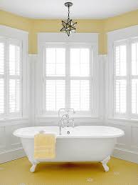 Pristine white walls deliver a clean, neutral backdrop for any yellow bathtub. Yellow Bathroom Decorating Design Ideas Better Homes Gardens