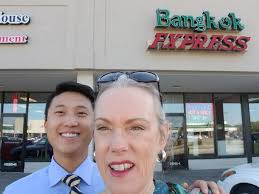 Agents Sangmin Kim & Karen Jay Sommerville talking to business owners  sharing ideas