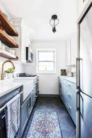 Here, a patterned floor and dark base cabinets ground the space, while the upper cabinets in a lighter color draw the eye up toward the ceiling. 15 Best Galley Kitchen Design Ideas Remodel Tips For Galley Kitchens