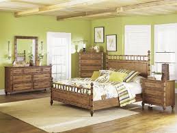The Use Of A Brighter Green On The Walls Is A Great Complement To This Magnussen Rustic Bedroom Set Island Style Bedroom Bedroom Sets Furniture