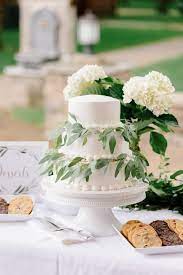 Classic 3 Tier White Buttercream Wedding Cake With Greenery Outdoor Wedding Reception Dessert T Wedding Reception Dessert Table Pavilion Wedding Swan Wedding