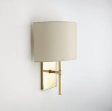 An essential part of any interior designers arsenal, wall lights allow you to create the home lighting scheme of your dreams. Wall Mounted Single Arm Sconce With Fabric Half Shade Products Waterworks Arm Sconce Modern Wall Sconces Wall Sconces