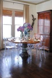 Love The Acrylic Chairs With The Antique Table And Chest Meg Lonergan Dining Room Remodel Ghost Chair Dining Room Round Wood Table