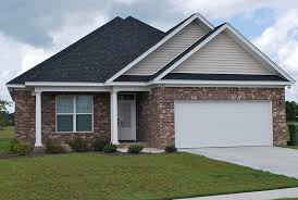 Building a structural header for a garage door opening can be handled on the jobsite and will offer the same structural support as more expensive solid wood beams. An Alternating Soldier Rowlock Course Header Above The Garage Door And Soldier Course Accent Band At The Top Of The Wall Help Give T Small House Homeowner Home