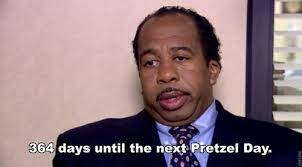 In 'pretzel day,' the office is excited when a pretzel man came to the lobby to deliver hot pretzels with a variety of toppings. Pretzel Day The Office Best Office Quotes Office Quotes Funny Office Quotes