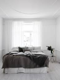 Monochrome minimalist bedroom design centers around one solid color. Perfection In White Brass And Dark Hues By Lotta Agaton Nordic Design Bedroom Interior Bedroom Design Minimalist Bedroom