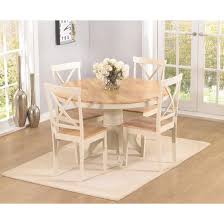 Suitable for large dining rooms, this round dining table is able to comfortably accommodate up to 10 guests, and is all made of wood with a distressed finish. Ashley Oak Cream Dining Table 4 Dining Chairs Fads