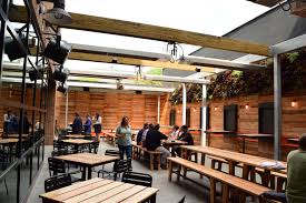 Bfm Seating Vista Arm Chair Is A Clean Modern Look Mixed In Nicely With The Picnic Tables And Wood Table Tops Outdoor Wood Restaurant Seating Restaurant Patio