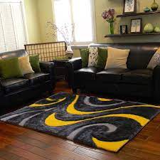 Then, a modern wood coffee table with metal hairpin legs completes the furniture arrangement. 25 Yellow Rug And Carpet Ideas To Brighten Up Any Room