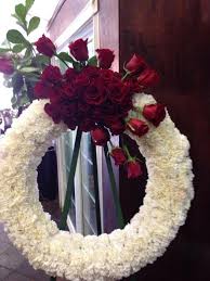 And pink carnations stand for remembrance. Wreath White Carnations And Cluster Of Red Roses Memorial Flowers Wreaths White Carnation