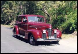 Image result for Trojan Maroon 1939 Oldsmobile