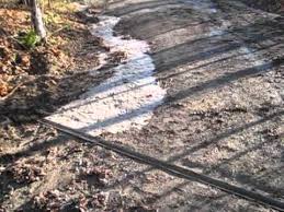 Adding a splash block, rocks, or stone pavers at the end of the extension to divert the redirected rainwater will minimize soil erosion as the rainwater leaves the extension. Water Diversion System For Driveways Youtube