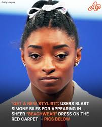 Simone Biles PARADED in a black,...