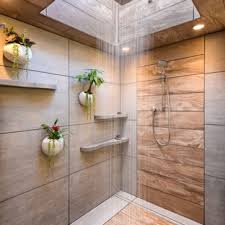 Minimalist bathroom idea indicates that you need to limit the number of accessories to the minimum, and you can do with just a shower screen and bath chamber, along with medium tone wood cabinets. Modern Bathroom Designs Savillefurniture