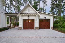 This piece was close to my heart! Exquisite South Carolina Farmhouse Evoking A Low Country Style Modern Farmhouse Exterior Farmhouse Garage Farmhouse Exterior