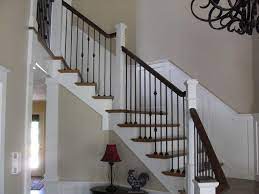 Beautiful Staircase With White Risers Black Wrought Iron Balusters And Black And White Railing Traditional Staircase Iron Balusters Stair Decor