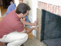 Craig used a metal tile edge to give the tile a clean look and hide the cut edges of tile. Reface A Fireplace With Stone Veneer How Tos Diy