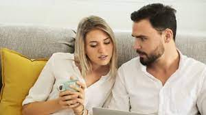 It's tired of working, and can't wait to relax. Young Couple Working Together Home Sofa Using Laptop Discussing Work Video By C Sasilsolution Stock Footage 241668258