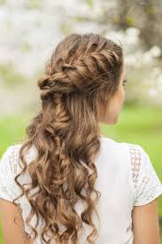 Part the hair, and starting at the crown, braid the hair and pin. 10 Elegant French Braids To Wear With Curly Hair