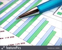Office And Close Up Close Up Of A Pen On Top Of A Financial Bar Chart With Numbers