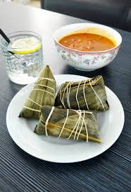 The traditional food for the dragon boat festival is zongzi. Traditional Chinese Food Dragon Boat Festival Dumpling Rice Dumplings And Sauce On Wooden Plate Stock Images Page Everypixel