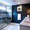 Fabulous white and navy bathroom features a navy vanity painted benjamin moore hale navy topped with carrera marble under a. 1