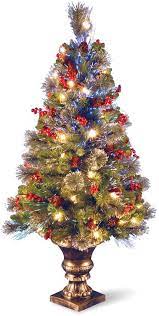Has a large inventory of outdoor christmas lights that can go on your tree, banister, porch railing or mailbox. 4 Fiber Optic Crestwood Spruce Christmas Tree Cones Glitter Red Berries In Gold Pot 139 0 Spruce Christmas Tree Cone Christmas Trees Green Christmas Tree