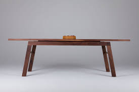 Modern Meets Minimal This Dining Table In Black Walnut Features A Floating Top Elevated Solid Brass Dining Table Table Furniture