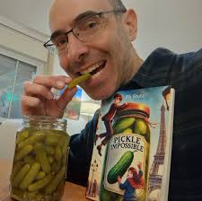 Ahhh, what could be better, eating a small, sweet French cornichon beside  an adventure story (that I happen to have written) about two French  children who must win a pickle contest! Did