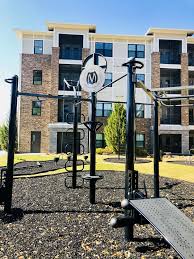 Apartment Complex Creates Outdoor Fitness Amenities For Its Residence Using The Movestrong T Rex A Great Wa Outdoor Workouts Outdoor Gym Outdoor Gym Equipment