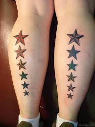 Beautiful small star tattoos in a cluster chain on feet. 62 Nice Star Tattoos For Leg