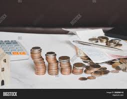As you do this, let the coins sift into a pile of their own. Coin Stack Money Image Photo Free Trial Bigstock