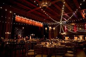 elegant candle light with bulb lights reception space at