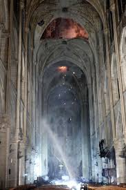 First Photos Inside Notre Dame Show Cross Shining Through The Smoke After Fire Ravages Cathedral French Landmarks Cathedral Paris