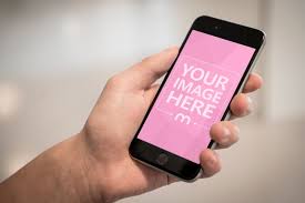 Closeup Mockup Shot Of A Person Holding An Iphone In Hand On A Blurred Background Click On The Device Screen To Upload Your Own Im Iphone Iphone Mockup Mockup