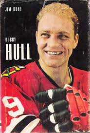 Golden Blades Harry Howell stays close to Jets Bobby Hull -.-